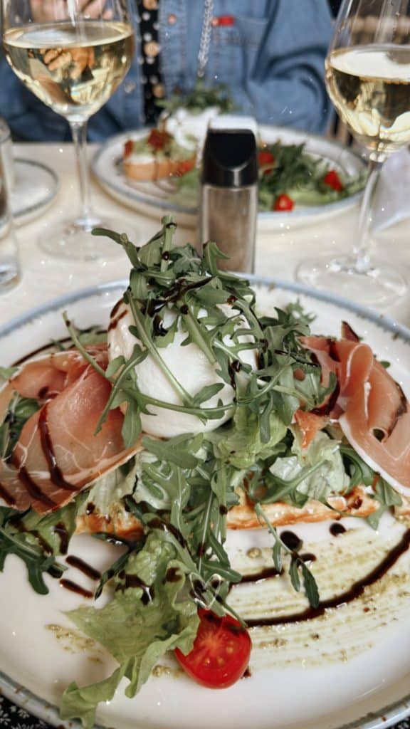 A dish with burrata and ham at Brunchology in Funchal