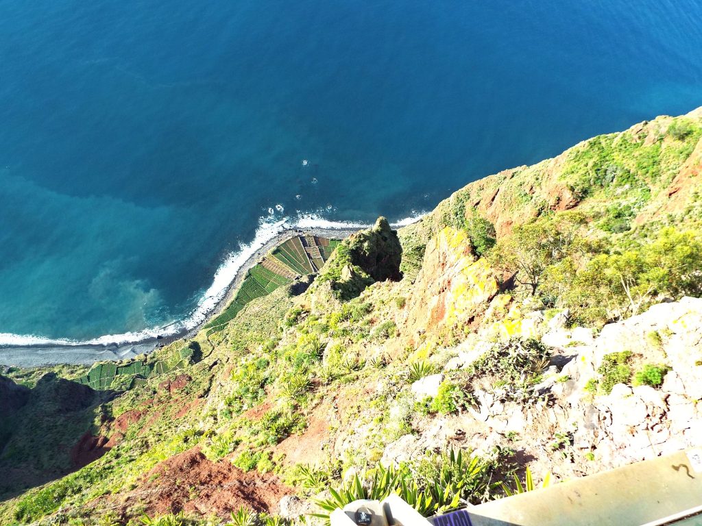 View from the Cabo Girão platform straight down to the fajã fields and the ocean