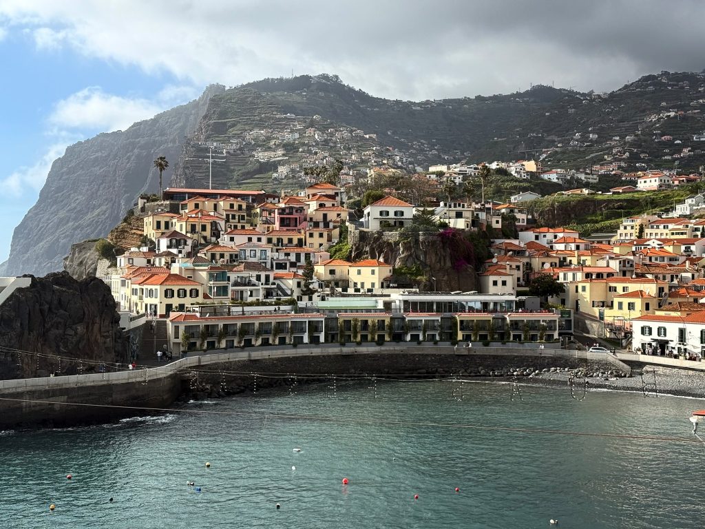 The bay of Câmara de Lobos with the Cabo Girão cliff under clouds
