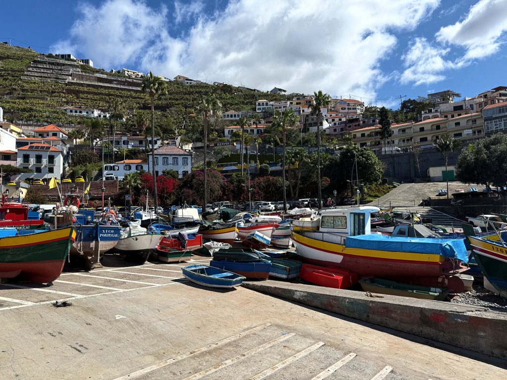 Colourful fishing boats on the quay in Câmara de Lobos