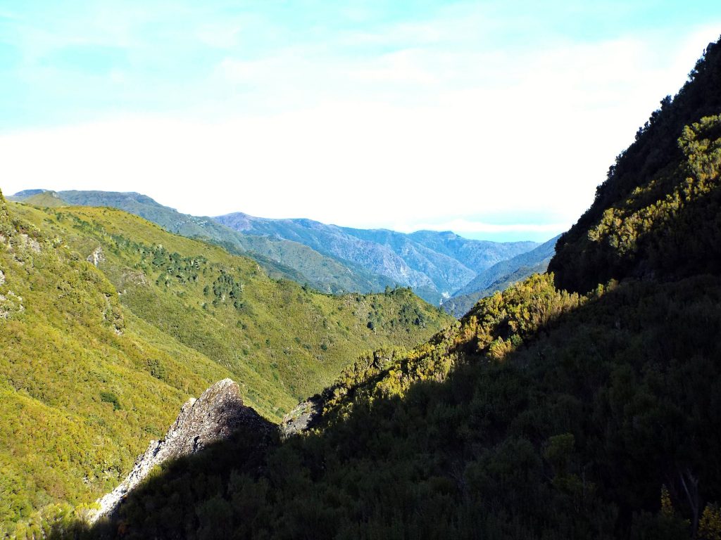 A green mountain valley seen from the trail at Rabaçal