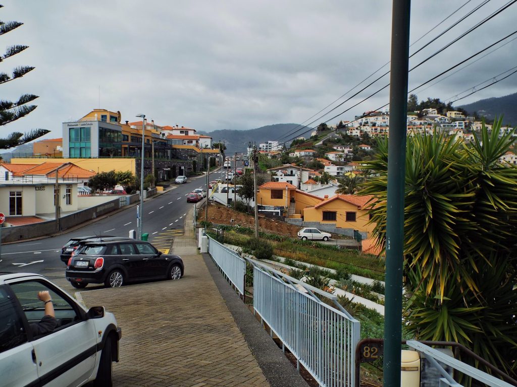 Cars parked on a steep street in Funchal