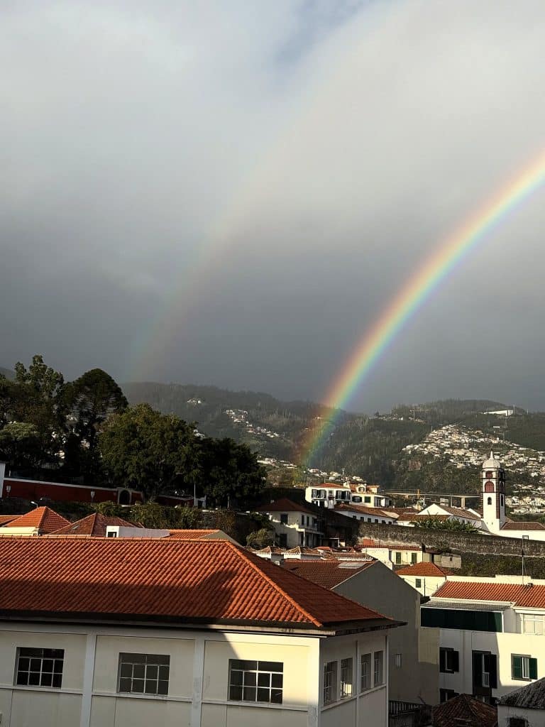 A rainbow over the rooftops of Funchal
