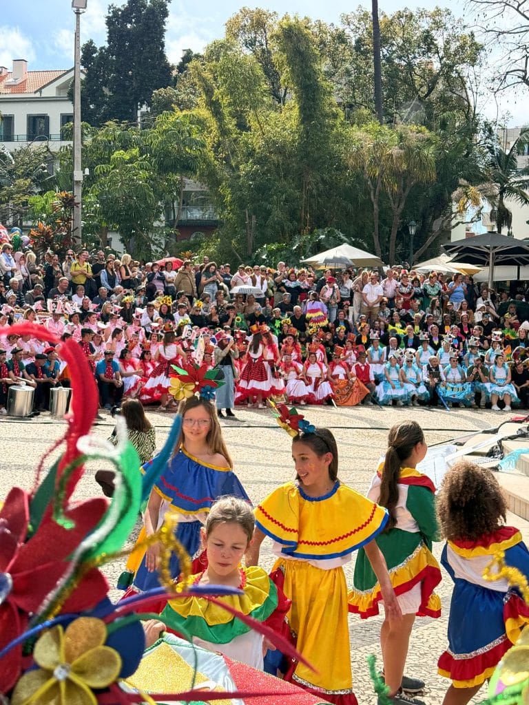 Children in colourful Carnival costumes in the Municipal Garden in Funchal