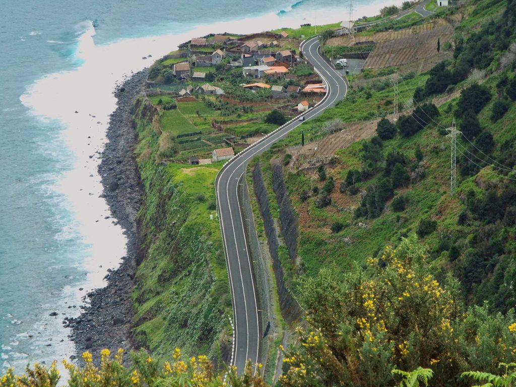 Winding road between fields above the ocean on Madeira’s north coast