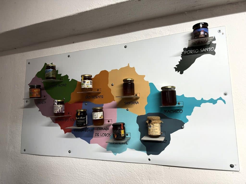 Map of Madeira with jars of honey from different municipalities at the Museu do Mel