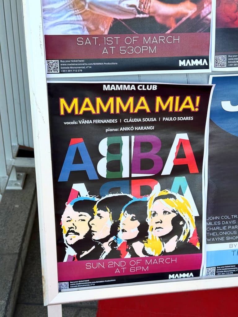 A colourful “Mamma Mia!” concert poster with the word ABBA and a drawing of four faces, on display at the MAMMA museum