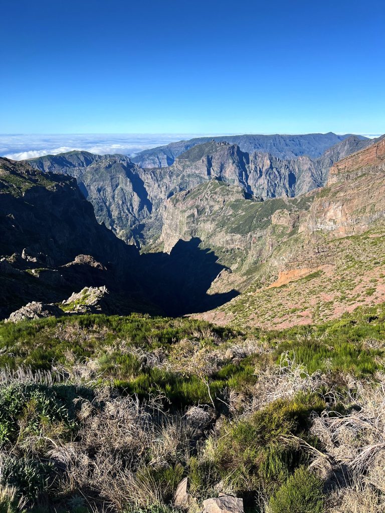 View from Pico do Arieiro over rocky peaks and deep valleys in the heart of Madeira