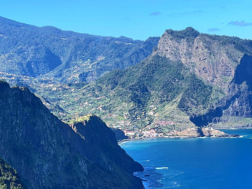 Steep cliffs on Madeira’s north coast, with Penha d’Águia and Porto da Cruz in the distance