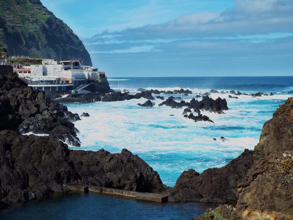 Natural pools in solidified lava and the ocean in Porto Moniz