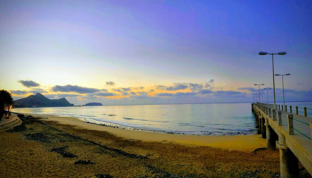 Sunset over the beach by the pier in Vila Baleira on Porto Santo