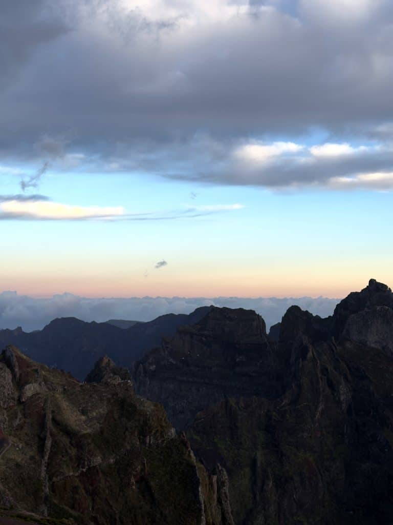 Jagged peaks of Madeira’s mountains against a pink dawn sky