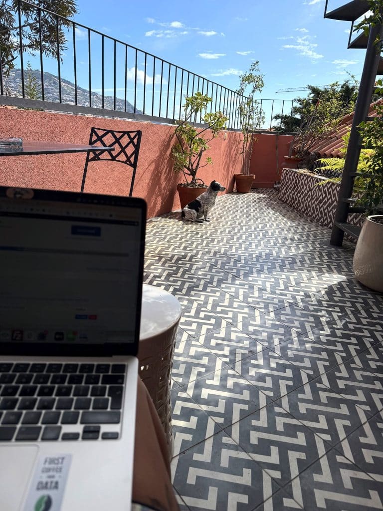 A laptop on a table on an apartment terrace in Funchal