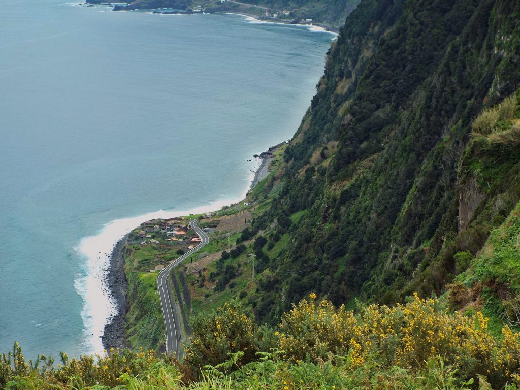 Madeira’s north coast and the coast road at the foot of the cliffs near Ribeira da Janela